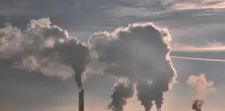 silhouette of building under white clouds during daytime